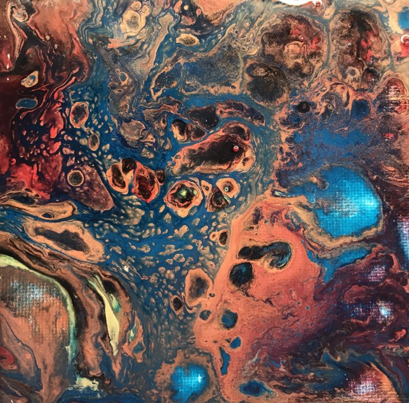 Acrylic paint pour on canvas completed with flip cup technique turquoise copper red black and gold paints all mixed with cells popping
