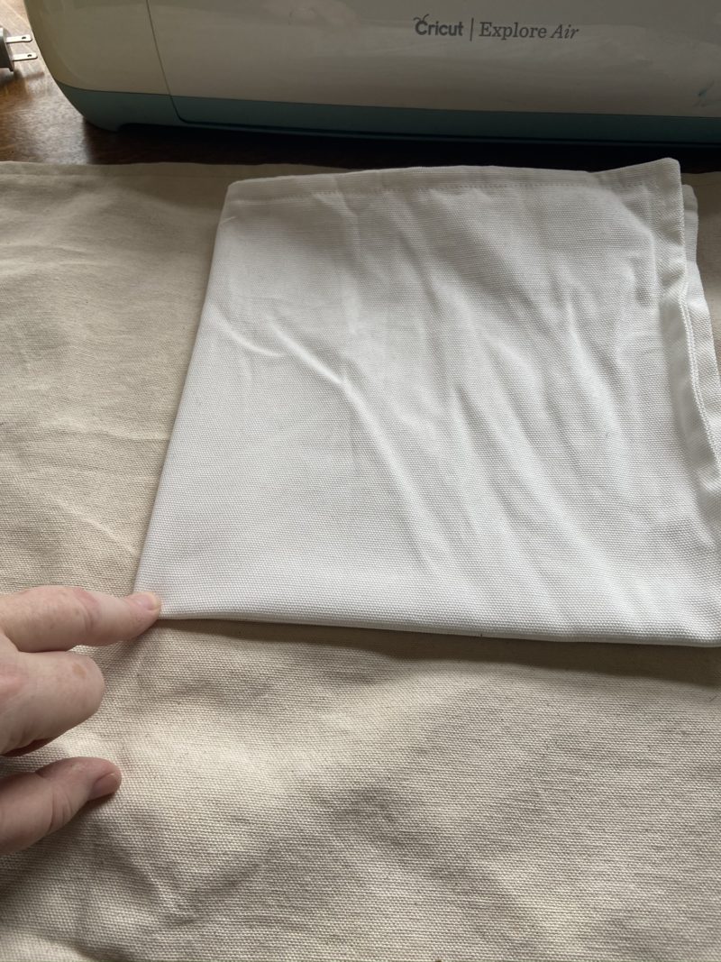 Pillow case folded in quarters to mark lines