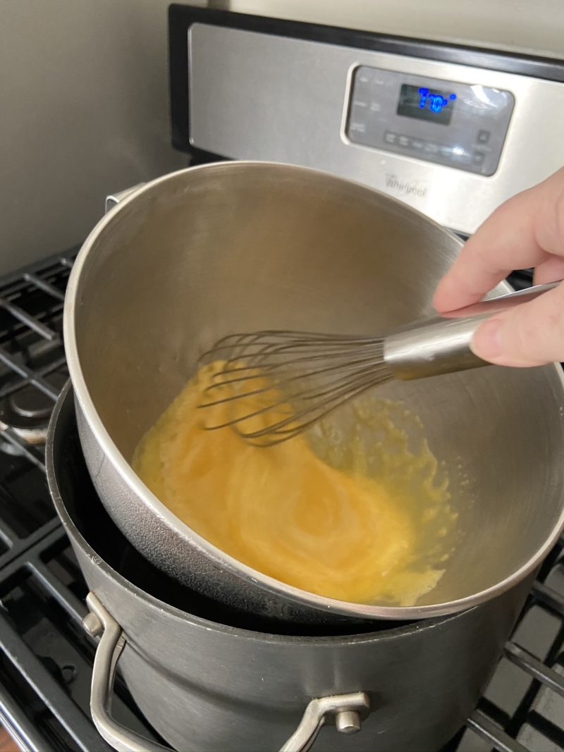 Heating eggs over double boiler for whipping into ribbons for chocolate cake