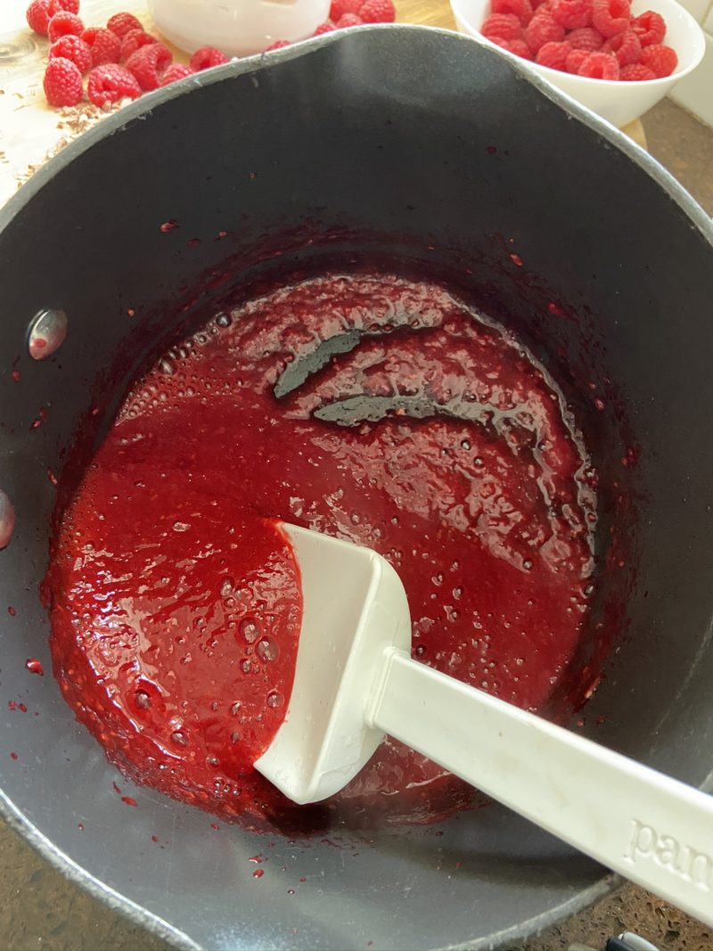 Raspberries cpoking in a pan