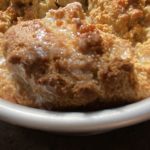 Gluten free keto irish soda bread baked golden brown with butter melting on top