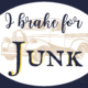 I brake for junk sign navy with yellow and a truck image