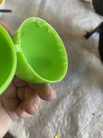 plastic easter egg with glue
